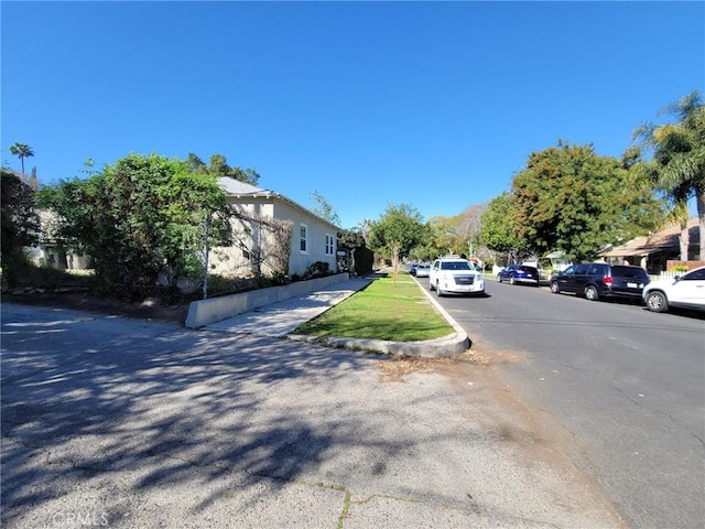 view of street featuring curbs