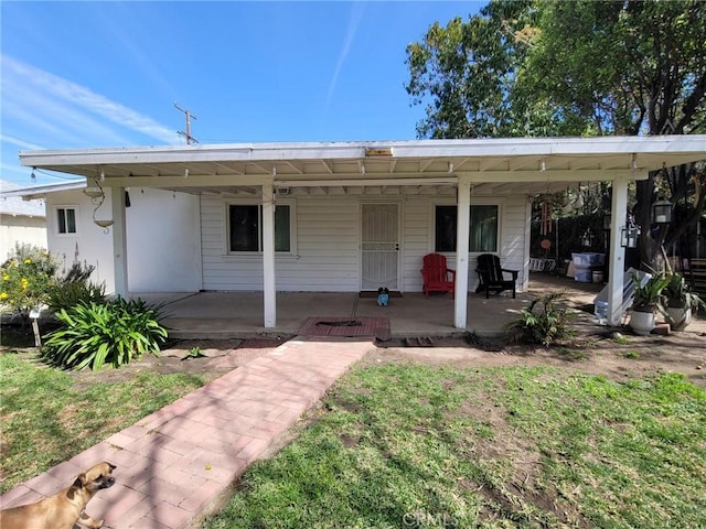 back of property with a patio area