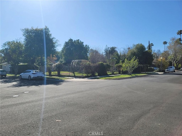 view of street featuring curbs and sidewalks