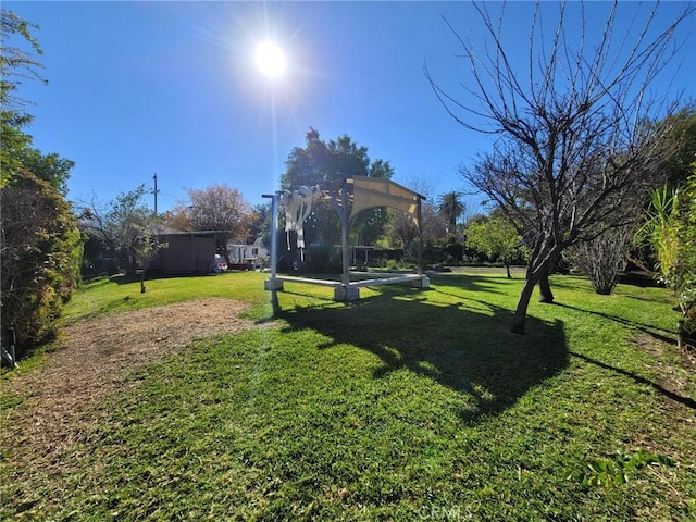 view of yard with a pergola