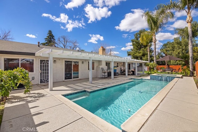 view of pool featuring a patio, fence, a pool with connected hot tub, and a pergola