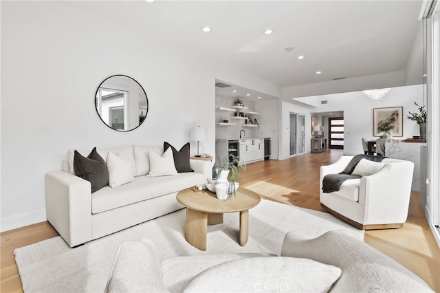 living room with recessed lighting and light wood-style floors