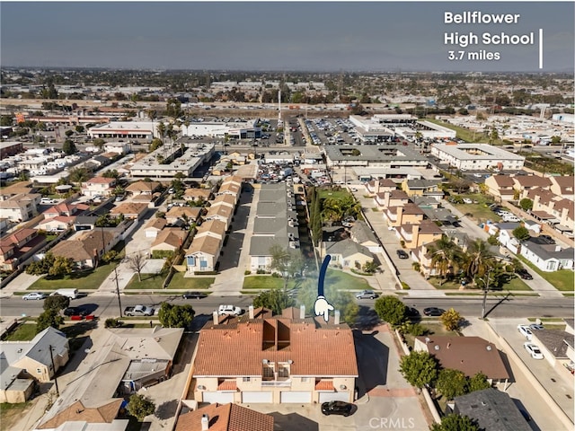 birds eye view of property with a residential view