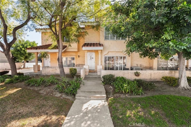 view of front of house featuring stucco siding