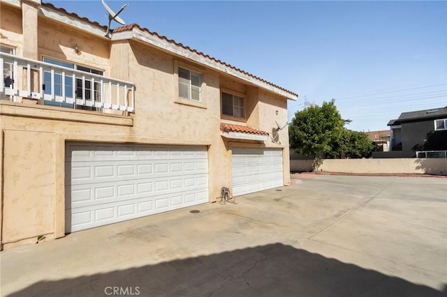 exterior space featuring concrete driveway