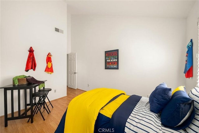 bedroom with visible vents and light wood-type flooring