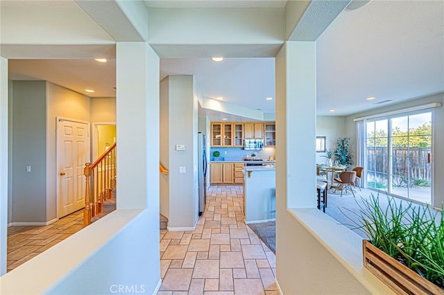 interior space with stairway, recessed lighting, baseboards, and stone finish floor