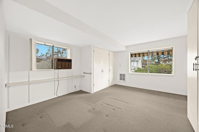 unfurnished bedroom with carpet and visible vents