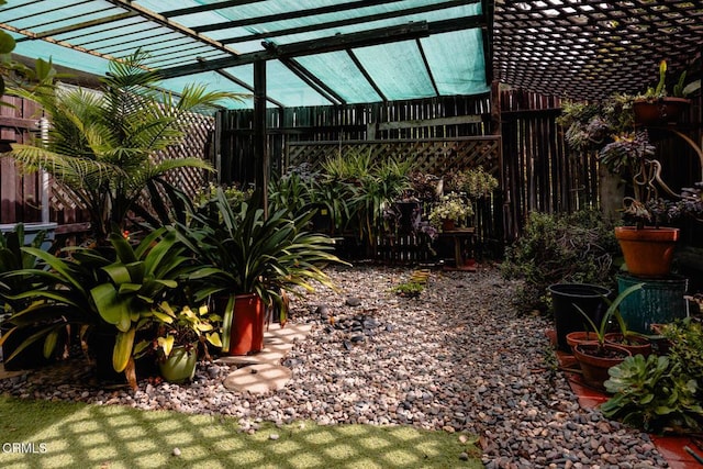 view of yard with a pergola and a fenced backyard