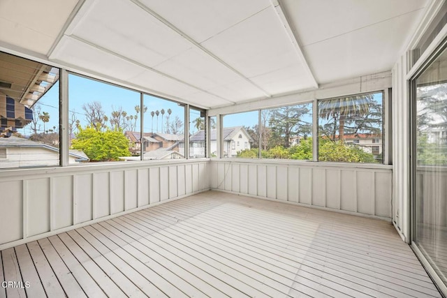 unfurnished sunroom featuring a healthy amount of sunlight