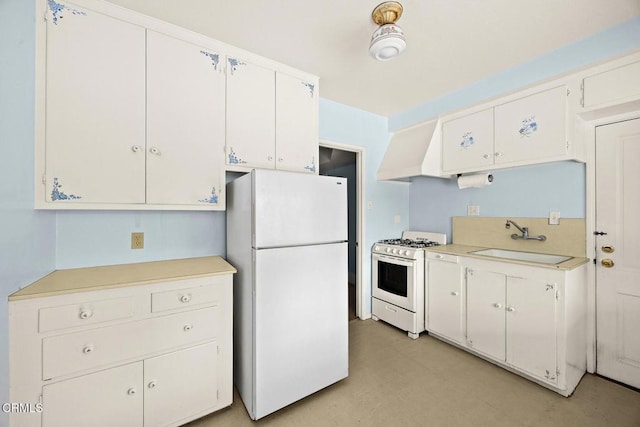 kitchen with custom range hood, a sink, white cabinetry, white appliances, and light countertops