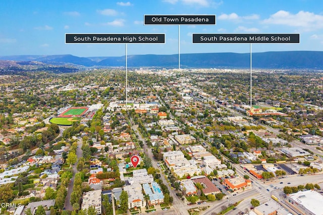 birds eye view of property with a mountain view