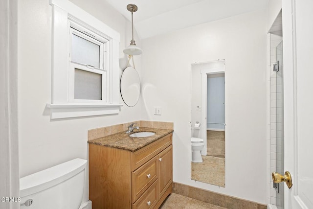 full bathroom featuring toilet and vanity