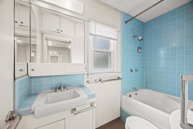 full bathroom with vanity, toilet, tasteful backsplash, and shower / bath combination