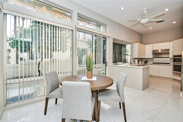 dining area featuring recessed lighting, visible vents, and marble finish floor