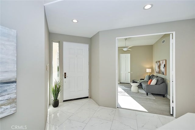 entryway with recessed lighting, visible vents, marble finish floor, and ceiling fan