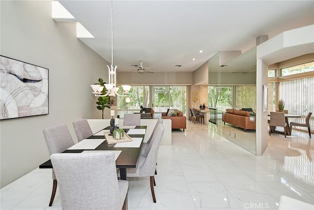 dining room with recessed lighting, marble finish floor, a high ceiling, and a ceiling fan