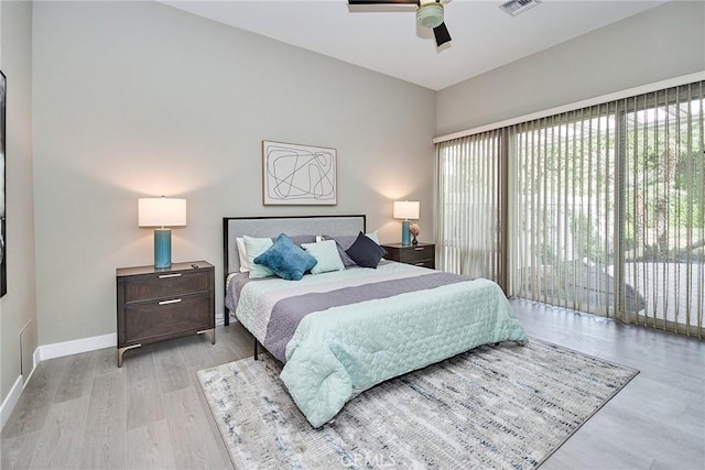 bedroom with access to exterior, light wood-style flooring, baseboards, and ceiling fan