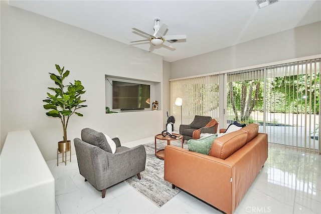 living room featuring visible vents and ceiling fan