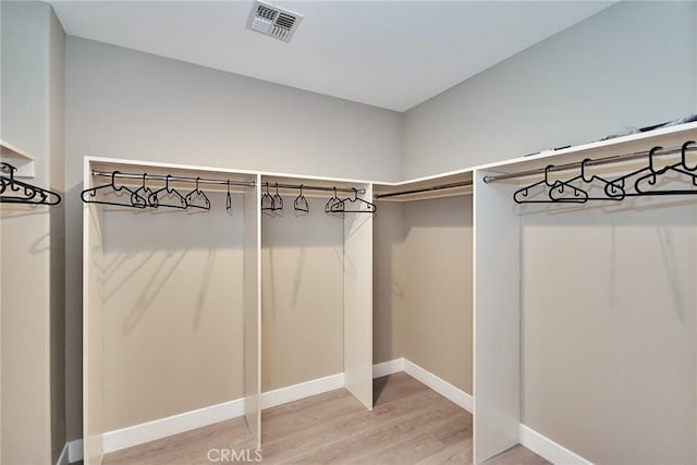 spacious closet with visible vents and light wood-style flooring