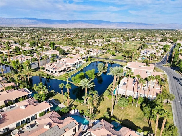 aerial view featuring a residential view and a water and mountain view