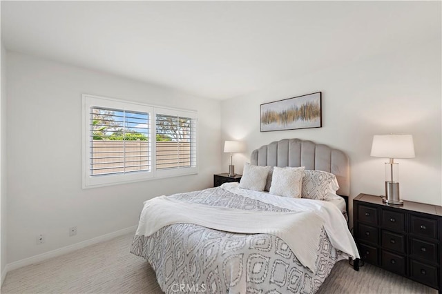 carpeted bedroom with baseboards