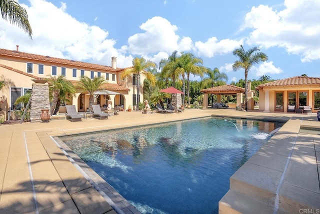 pool with a gazebo and a patio area