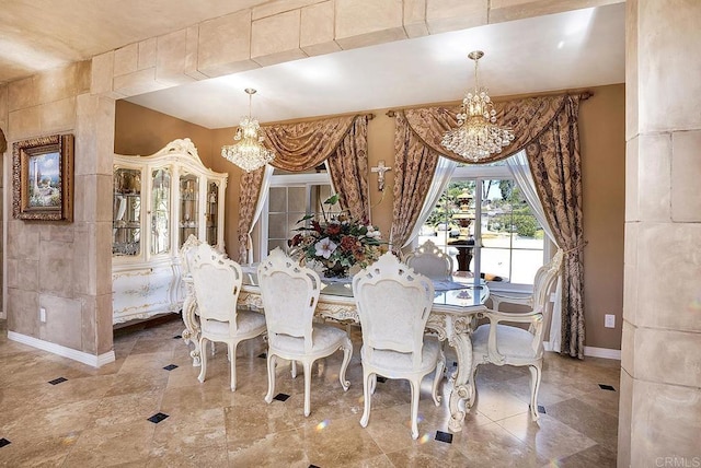 dining room with an inviting chandelier and baseboards