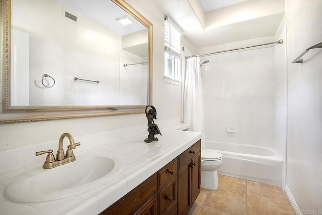 bathroom featuring vanity, shower / bathtub combination with curtain, toilet, tile patterned flooring, and visible vents