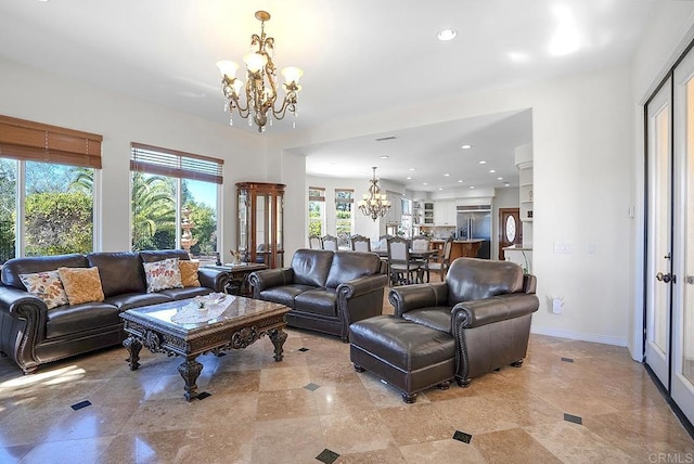 living area with baseboards, recessed lighting, and a chandelier