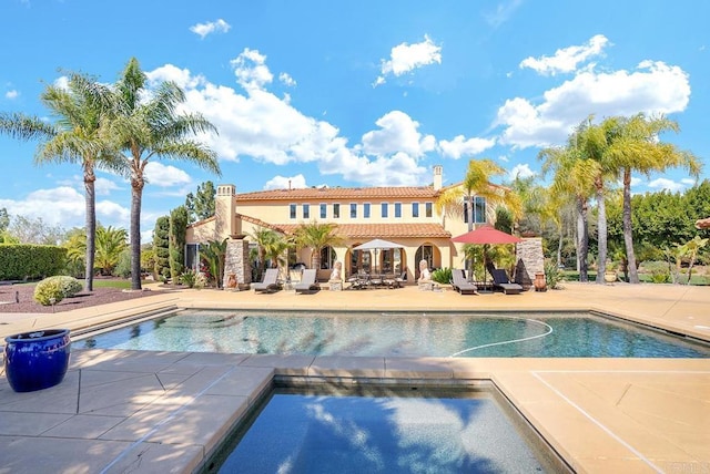 pool with a patio area