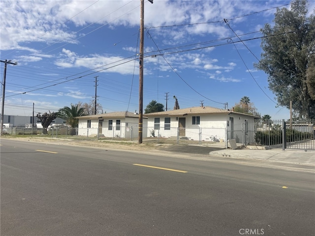 single story home with a fenced front yard