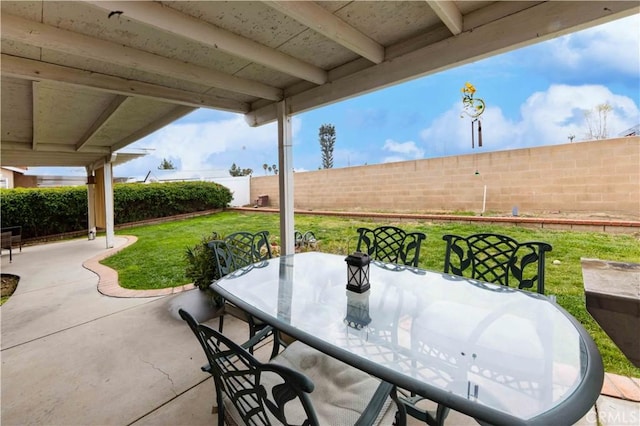 view of patio featuring a fenced backyard and outdoor dining space