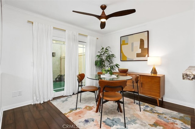 sitting room with baseboards, wood finished floors, a ceiling fan, and ornamental molding