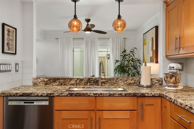 kitchen featuring dishwasher, dark stone counters, ornamental molding, a ceiling fan, and a sink