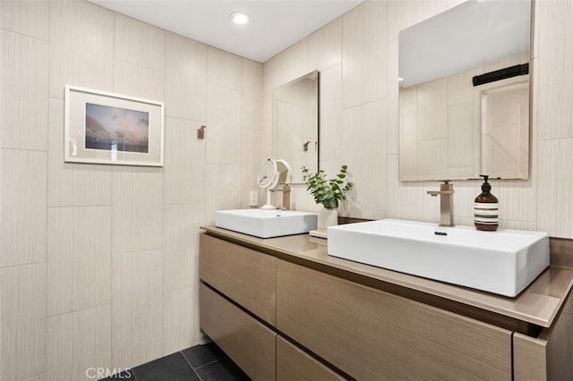 bathroom featuring double vanity and a sink