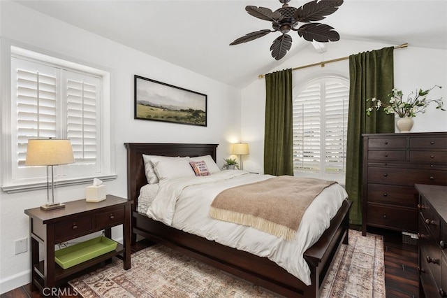 bedroom featuring baseboards, a ceiling fan, lofted ceiling, and wood finished floors