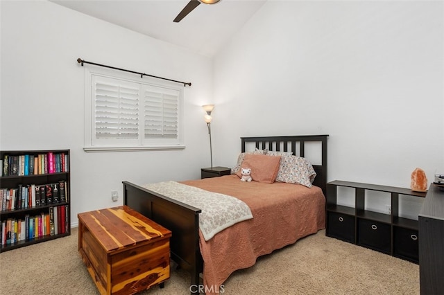 carpeted bedroom with lofted ceiling and ceiling fan