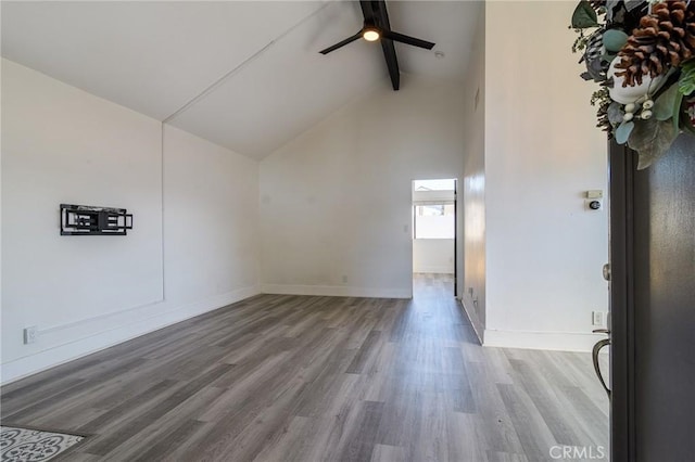 bonus room featuring beam ceiling, wood finished floors, and baseboards