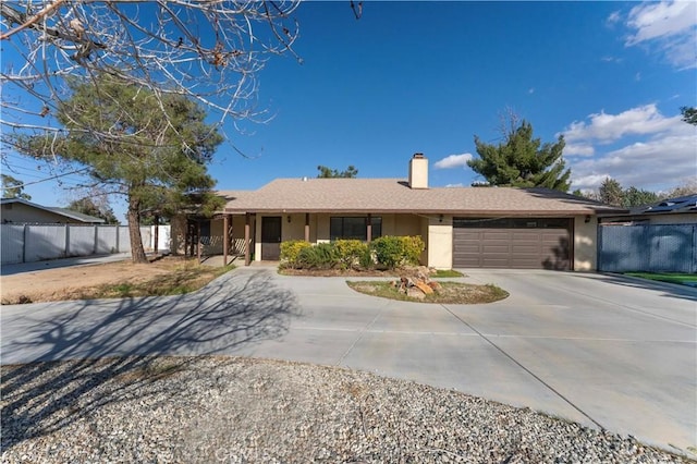 ranch-style home featuring fence, driveway, a chimney, stucco siding, and a garage