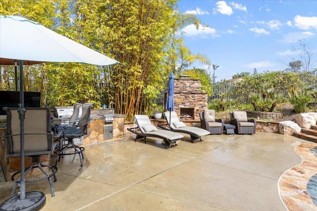 1905 Oxford Ct, Vista, CA 92081 - view of patio / terrace with an outdoor stone fireplace and area for grilling