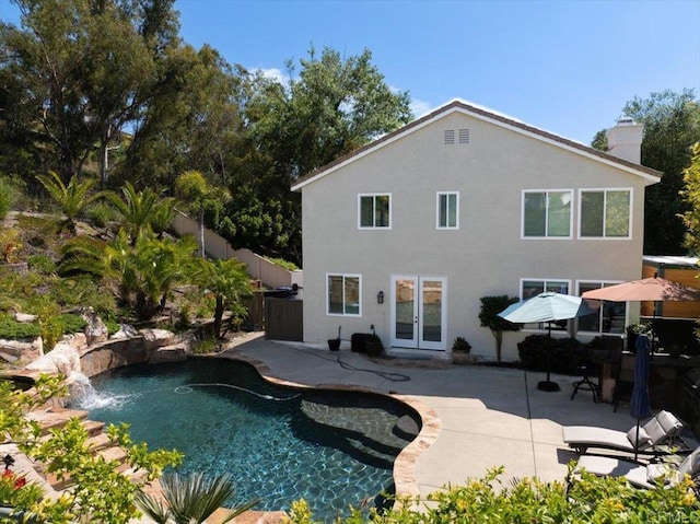 1905 Oxford Ct, Vista, CA 92081 - back of property featuring french doors, a chimney, a patio, an outdoor pool, and stucco siding