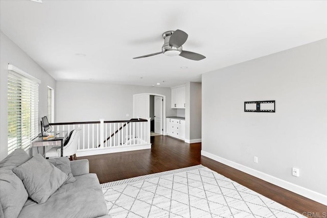 1905 Oxford Ct, Vista, CA 92081 - living area with wood finished floors, arched walkways, and ceiling fan