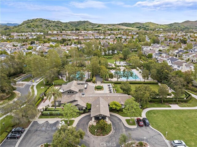 birds eye view of property featuring a mountain view and a residential view