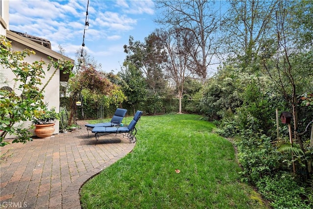 view of yard with fence and a patio area