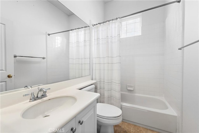 full bathroom with shower / bath combo with shower curtain, toilet, and vanity