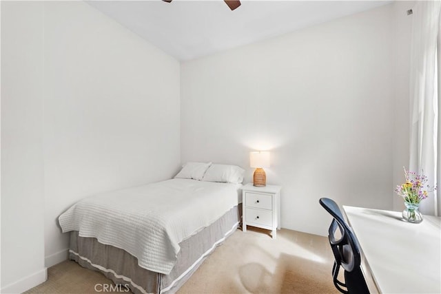 bedroom with ceiling fan and carpet floors