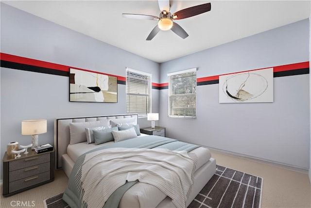 carpeted bedroom featuring a ceiling fan