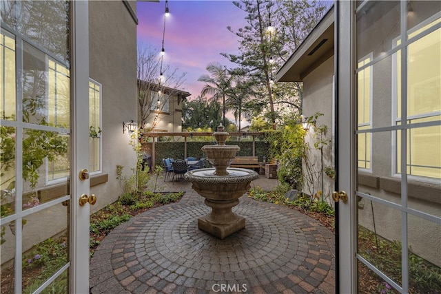 view of patio terrace at dusk