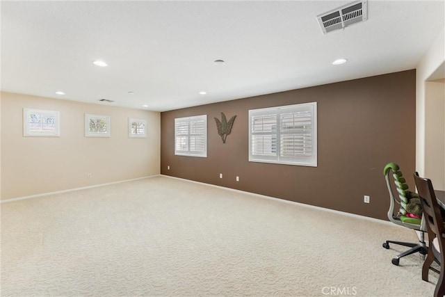 unfurnished office featuring recessed lighting, visible vents, baseboards, and carpet flooring